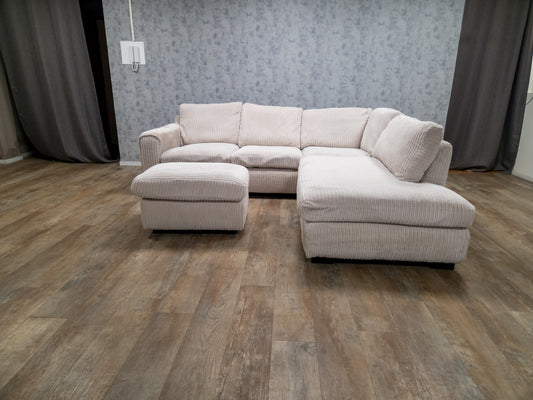 PRACHTIG BEIGE RIBSTOF HOEKBANK met POEF